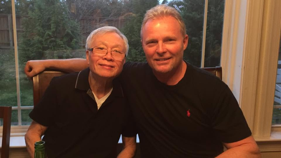 Michael Agee seated with his father-in-law, a former officer in the South Vietnamese Army.